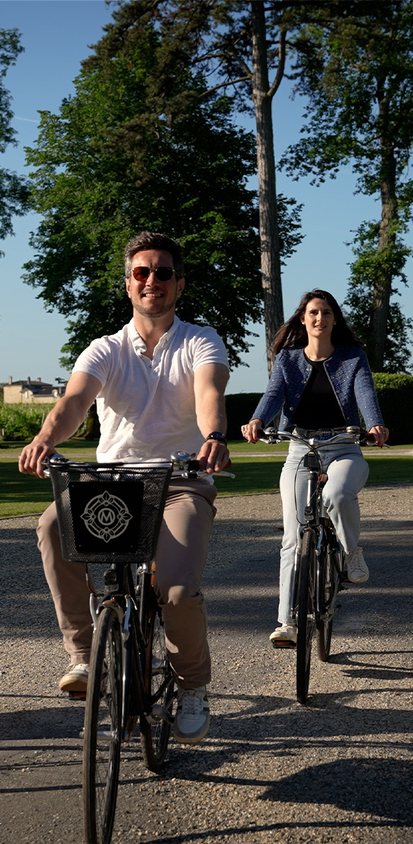 two women on bikes from behind